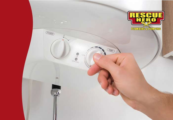 Tankless water heater mounted on wall with gas and water connections