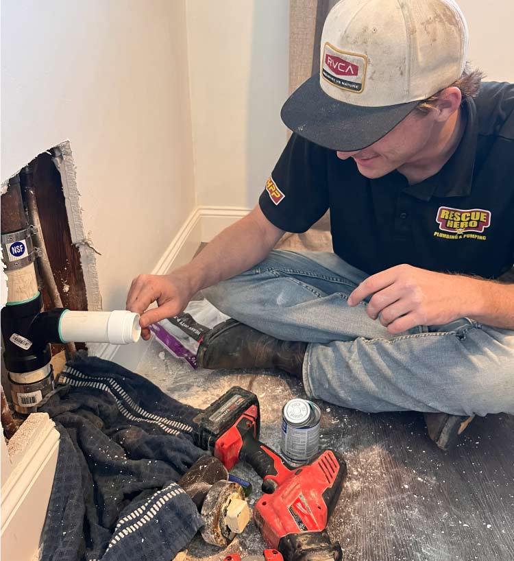 Emergency plumber in Arvin, CA driving a branded truck to a home for an after-hours burst pipe repair in a residential neighborhood