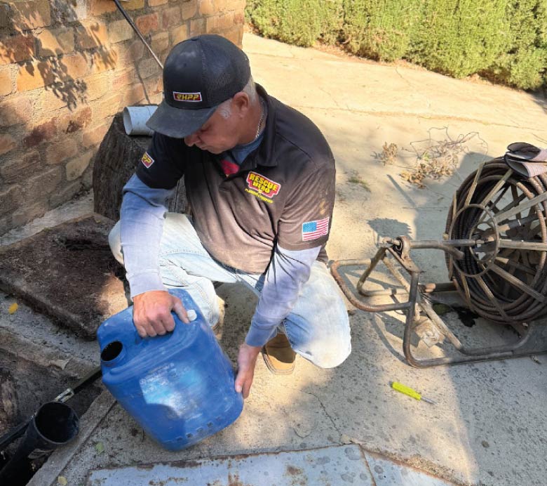 Rescue Hero Plumbing technician performing a septic tank inspection and maintenance in Wofford Heights, CA, using professional equipment to ensure system health.