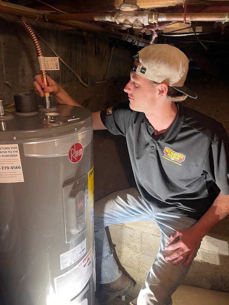Energy-efficient residential tankless water heater unit mounted on an interior wall with copper line connections BY A PLUMBER IN LEBEC, CA